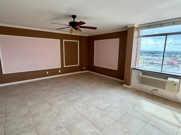 a view of an empty room with a window