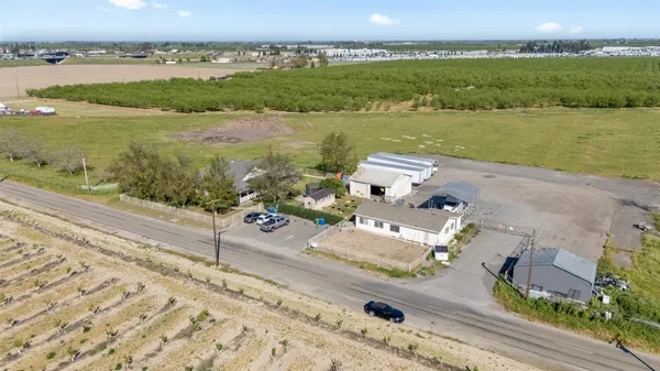 an aerial view of a house with a lake view