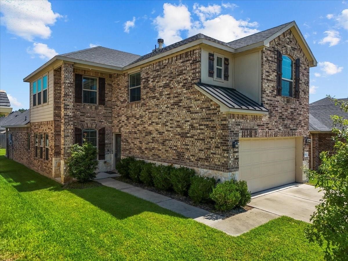 5111 Bay Lane Bacliff, TX 77518 - Photo 3 of 48 a front view of a house with garden