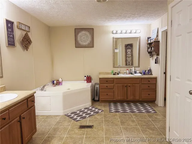 a bathroom with a sink a toilet and shower curtain
