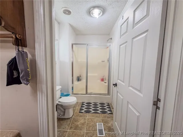 a view of room with painting on the wall