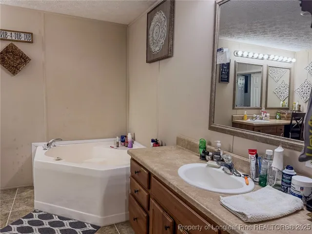 a bedroom with a bed a desk and chair