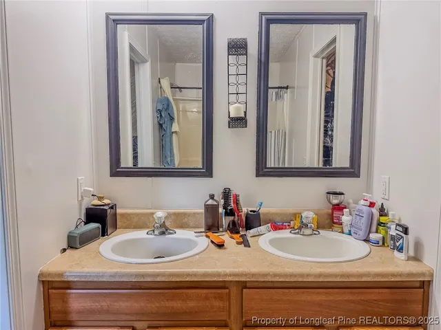 a bathroom with a toilet and shower curtain