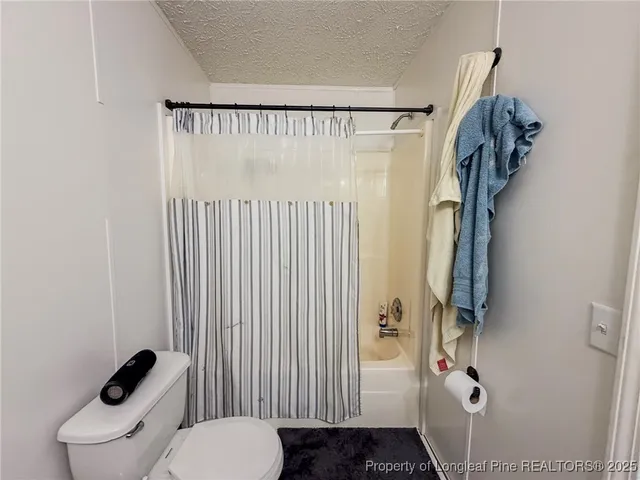 a bedroom with a bed and cabinets