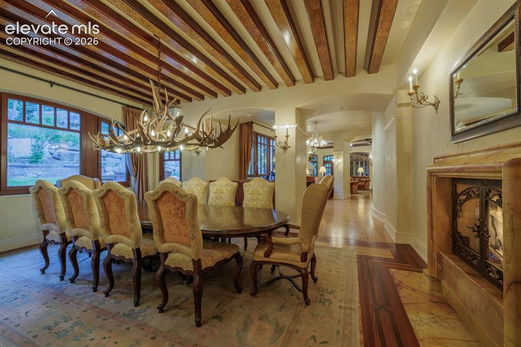 4530 Governors Point Colorado Springs, CO 80906 - Photo 32 of 49 Dining room with custom painted beams