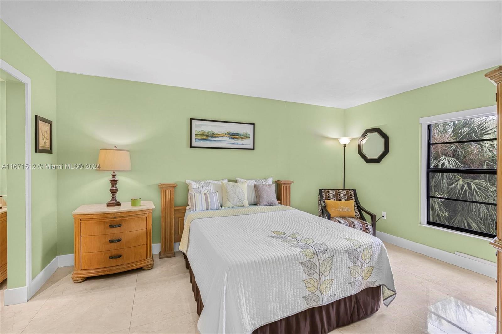 6300 Southwest 138th Court, Unit 307 Miami, FL 33183 - Photo 14 of 30 a bedroom with a bed a dresser and next to a window