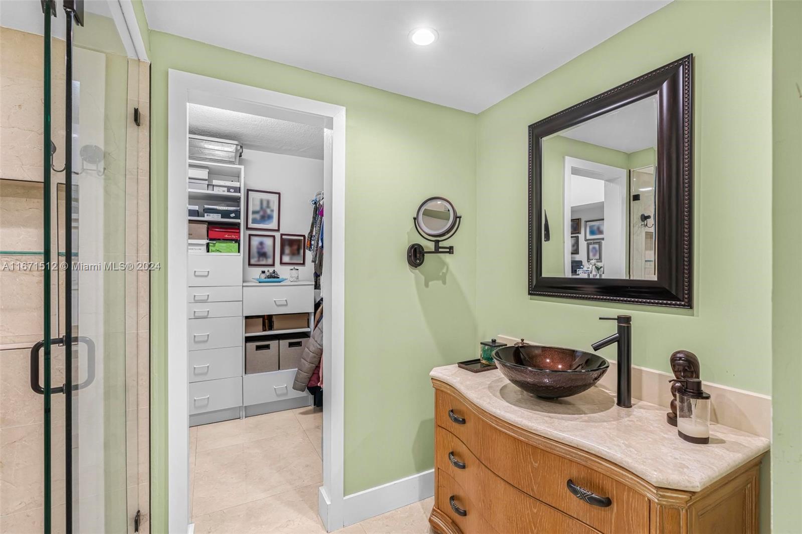 6300 Southwest 138th Court, Unit 307 Miami, FL 33183 - Photo 17 of 30 a bathroom with a sink and a mirror