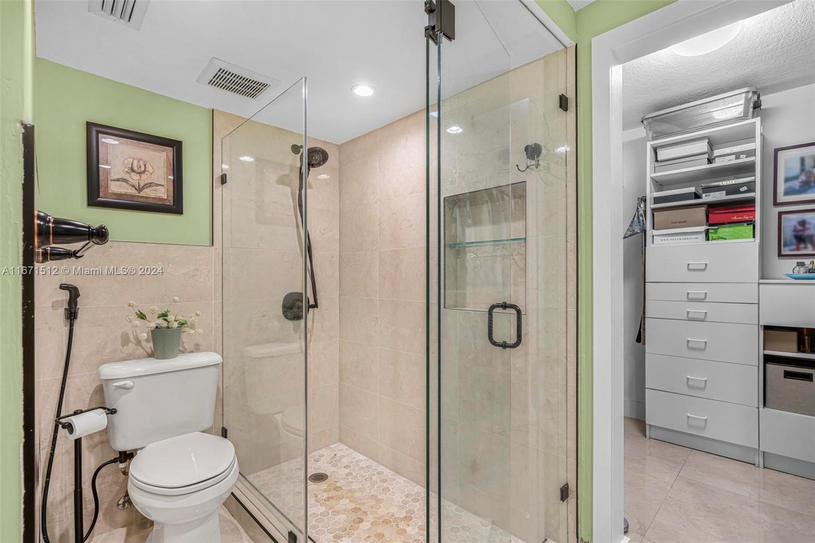 6300 Southwest 138th Court, Unit 307 Miami, FL 33183 - Photo 18 of 30 a bathroom with a shower toilet and a shower