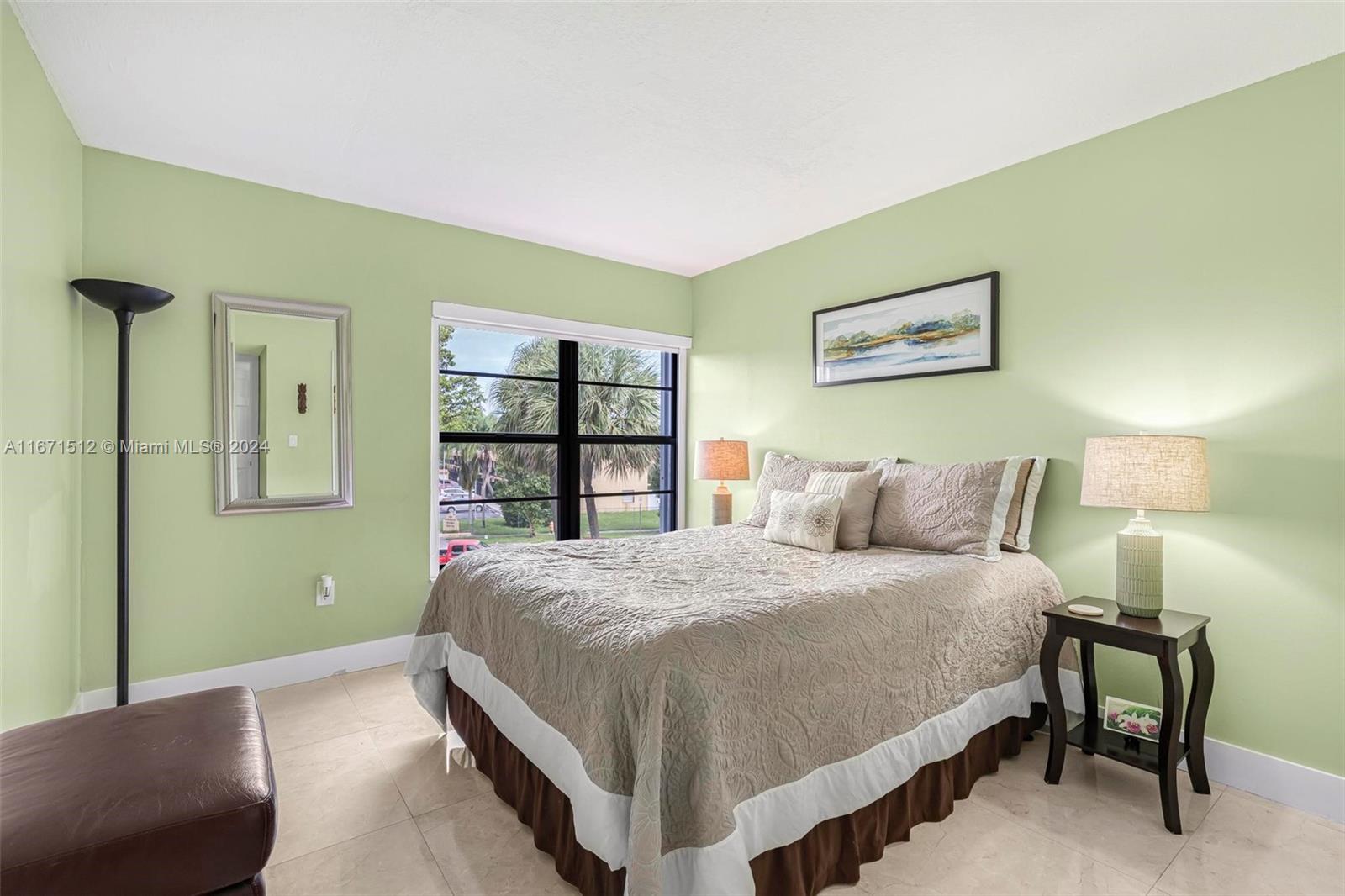 6300 Southwest 138th Court, Unit 307 Miami, FL 33183 - Photo 20 of 30 a bedroom with a bed and a book shelf