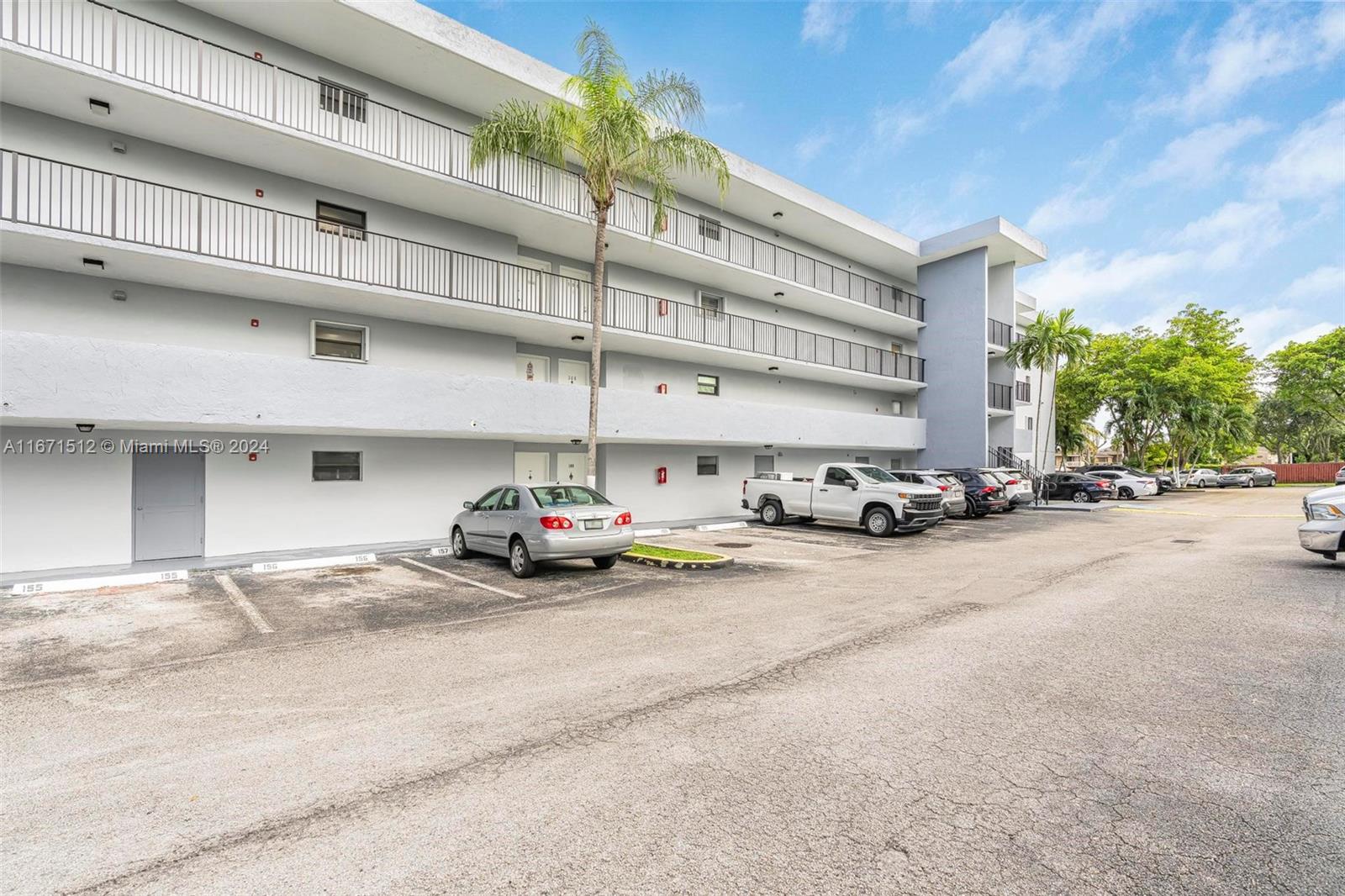 6300 Southwest 138th Court, Unit 307 Miami, FL 33183 - Photo 2 of 30 a car parked in front of a building