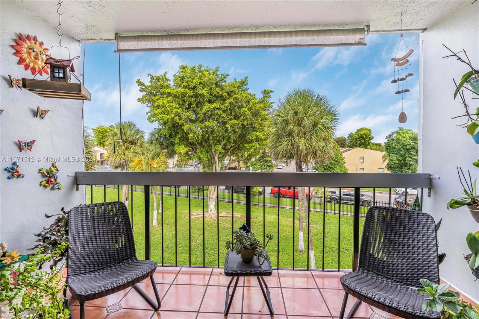 6300 Southwest 138th Court, Unit 307 Miami, FL 33183 - Photo 22 of 30 a view of a chairs and table in the balcony
