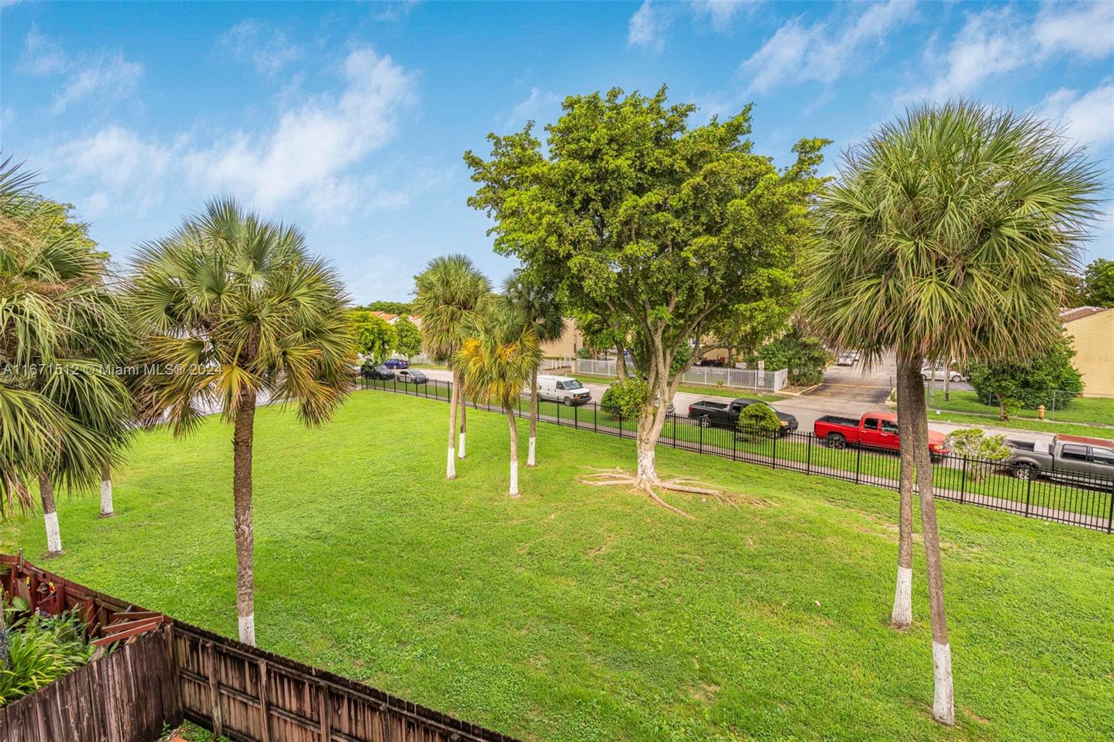 6300 Southwest 138th Court, Unit 307 Miami, FL 33183 - Photo 23 of 30 a view of a garden and swimming pool