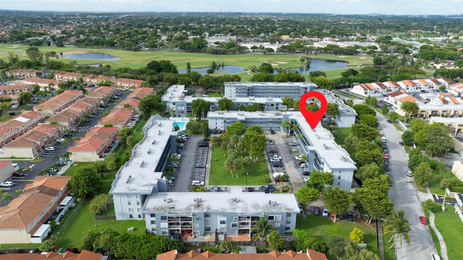 6300 Southwest 138th Court, Unit 307 Miami, FL 33183 - Photo 26 of 30 an aerial view of a houses with a lake view
