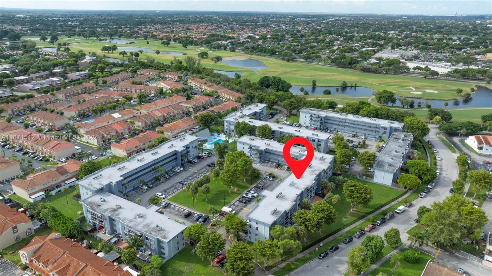 6300 Southwest 138th Court, Unit 307 Miami, FL 33183 - Photo 27 of 30 an aerial view of residential houses with outdoor space and parking