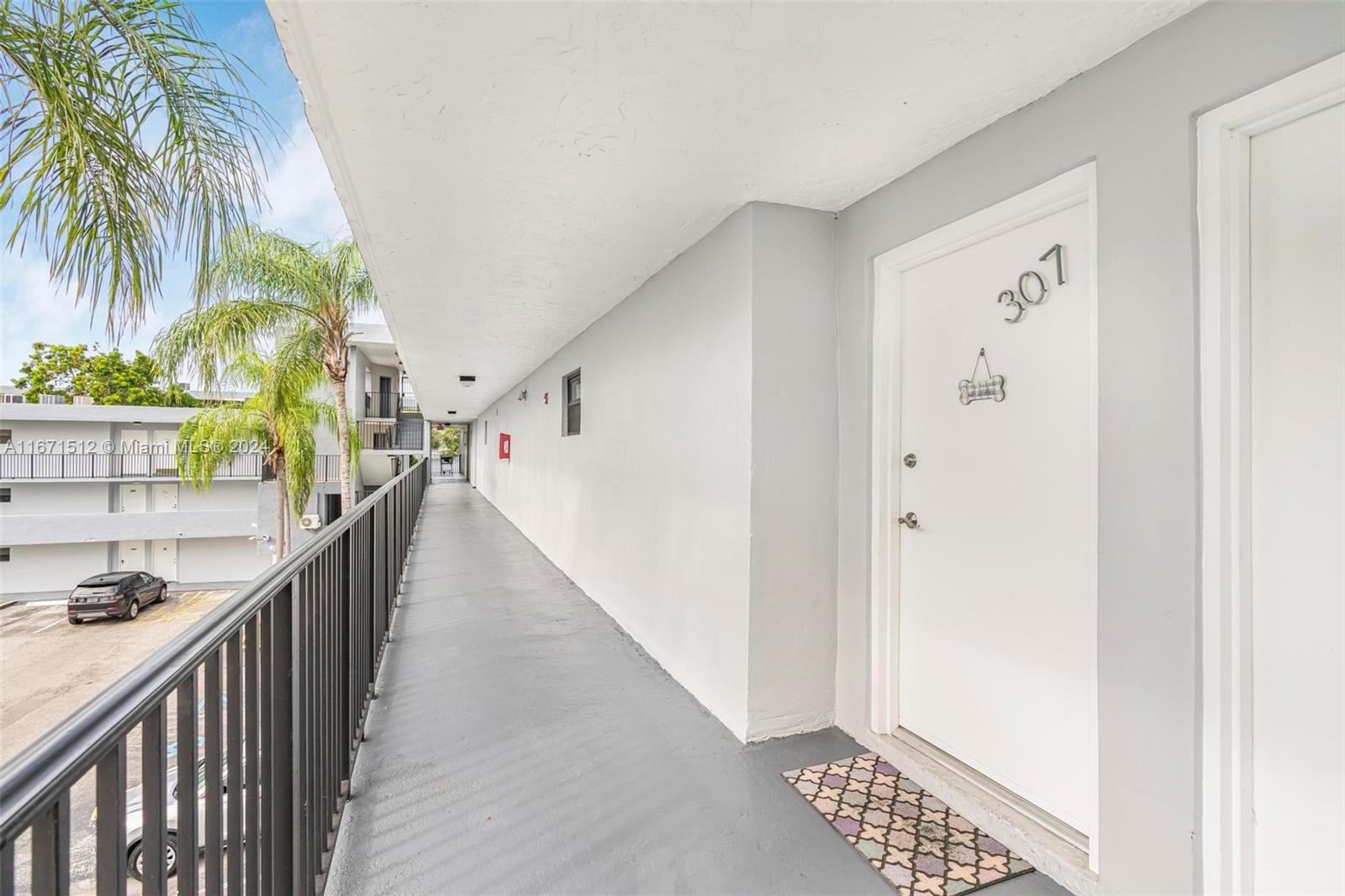 6300 Southwest 138th Court, Unit 307 Miami, FL 33183 - Photo 4 of 30 a view of entryway with wooden floor