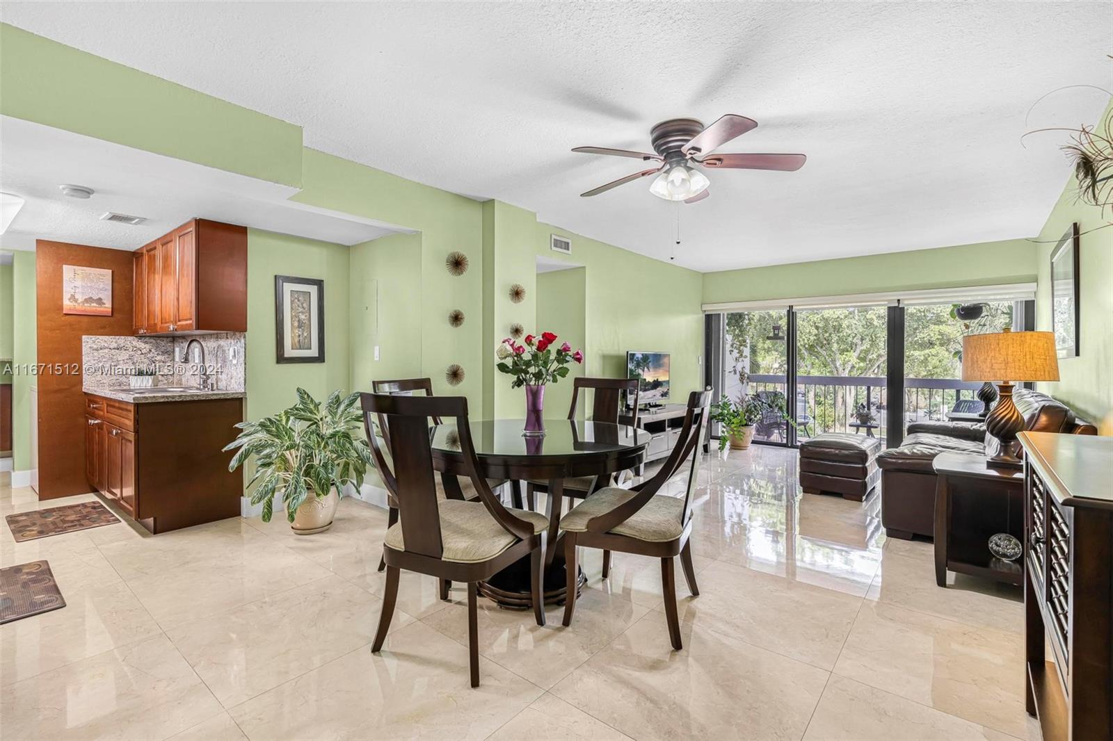 6300 Southwest 138th Court, Unit 307 Miami, FL 33183 - Photo 6 of 30 a view of a dining room with furniture window and outside view