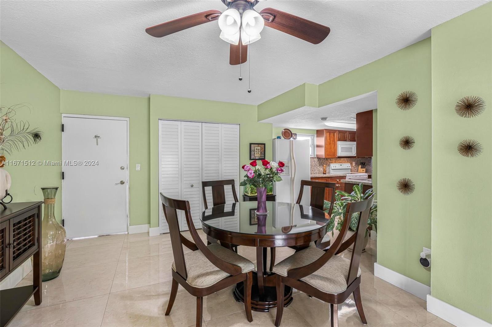 6300 Southwest 138th Court, Unit 307 Miami, FL 33183 - Photo 10 of 30 a view of a dining room with furniture and a chandelier