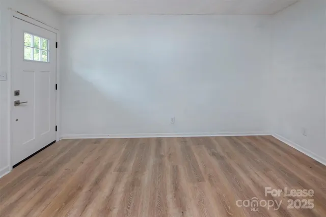 a view of an empty room and window