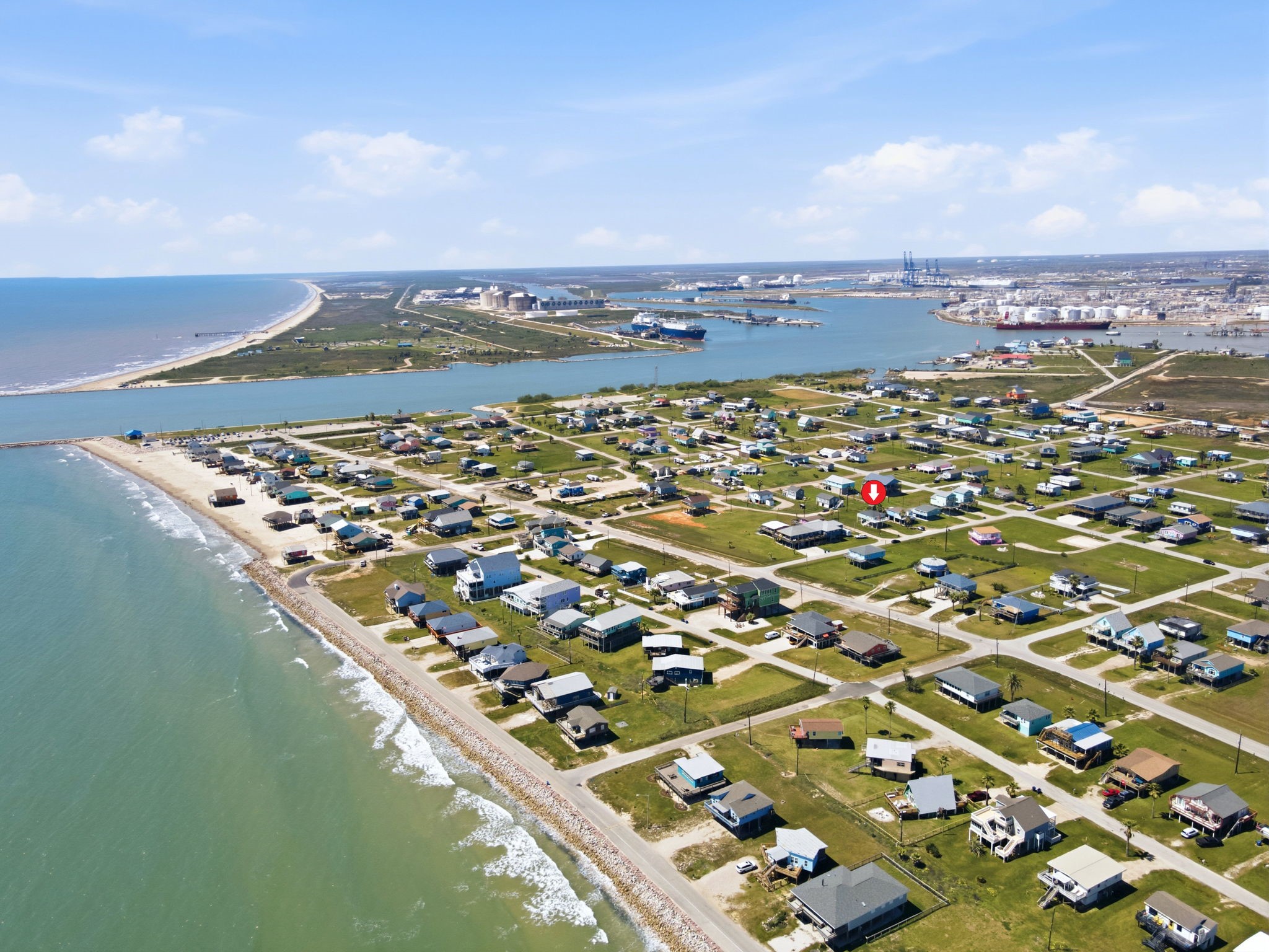 315 Caisson Street Surfside Beach, TX 77541 - Photo 15 of 32 Aerial View / Coastal Setting – Stunning aerial views highlight the home’s location near the water, with easy access to nearby shoreline and scenic surroundings.