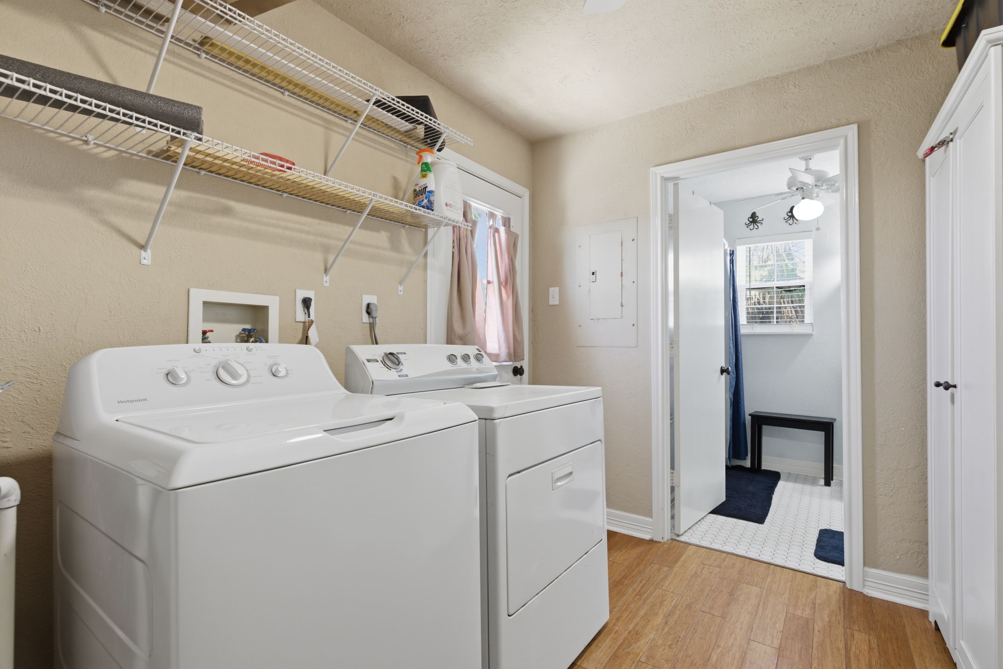 315 Caisson Street Surfside Beach, TX 77541 - Photo 23 of 32 Laundry Room (Alternate View) – Spacious laundry room with additional storage, utility access, and easy flow to adjacent living spaces.