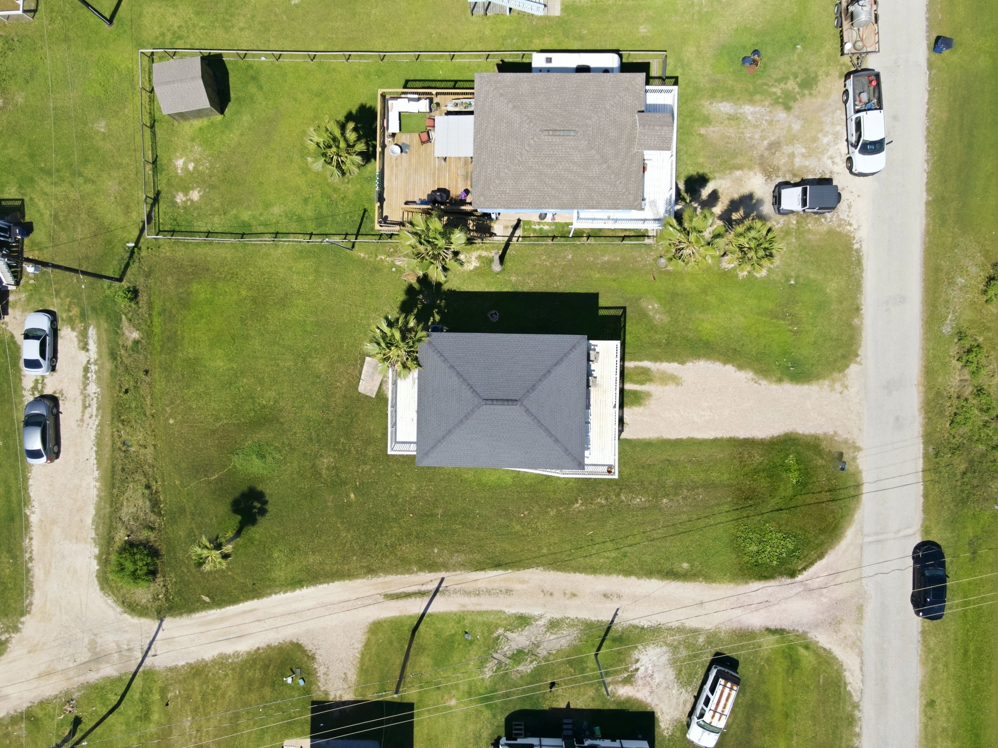 315 Caisson Street Surfside Beach, TX 77541 - Photo 31 of 32 Aerial View (Top-Down) – Overhead aerial view showcasing the property’s footprint, surrounding green space, and layout within the neighborhood.