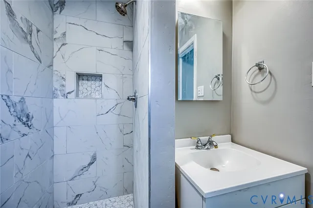 a bathroom with a sink and vanity