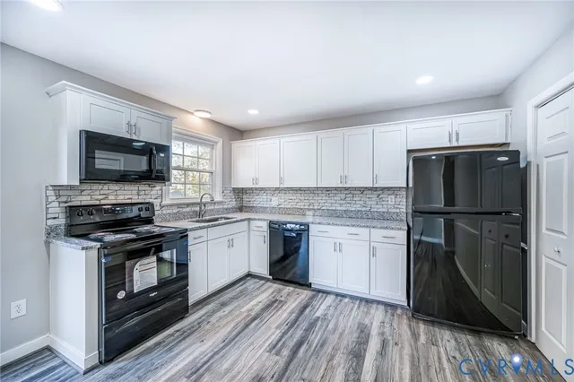 a kitchen with a sink stove and refrigerator
