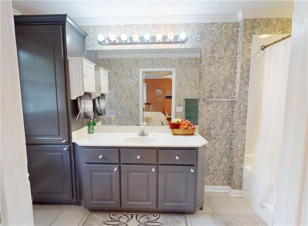 24 Austin Way Jefferson, GA 30549 - Photo 17 of 31 a bathroom with a sink vanity granite and a mirror