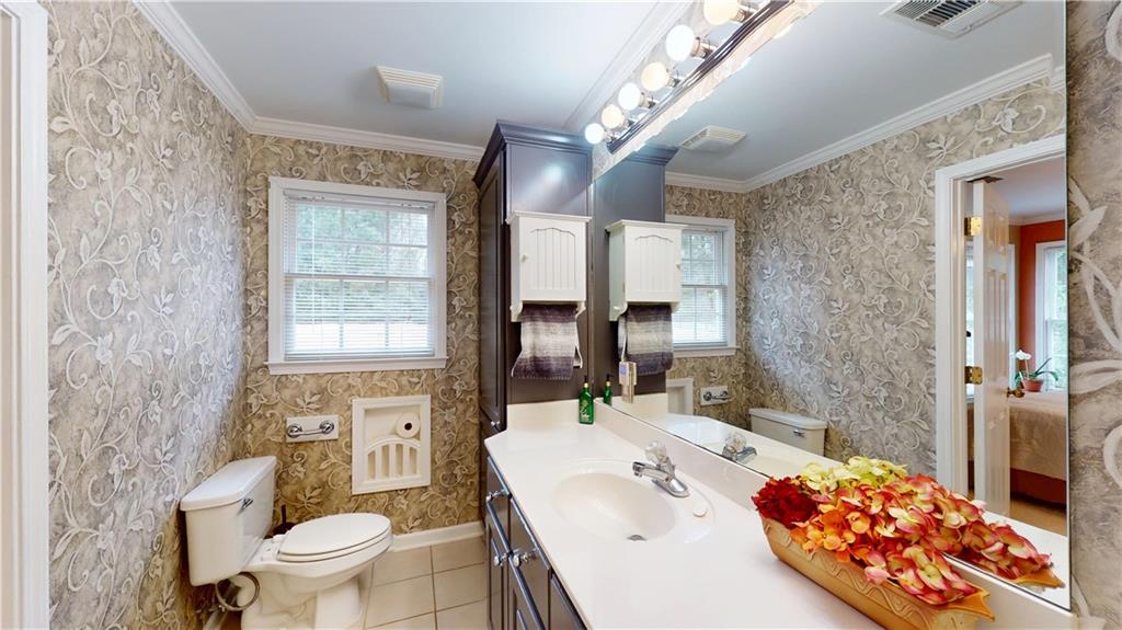 24 Austin Way Jefferson, GA 30549 - Photo 18 of 31 a spacious bathroom with a double vanity sink toilet and shower
