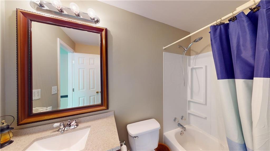 24 Austin Way Jefferson, GA 30549 - Photo 27 of 31 a bathroom with a sink a toilet and a mirror