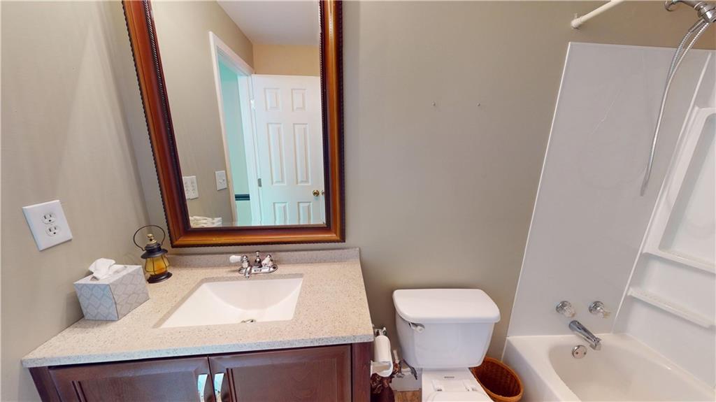 24 Austin Way Jefferson, GA 30549 - Photo 28 of 31 a bathroom with a sink and a mirror