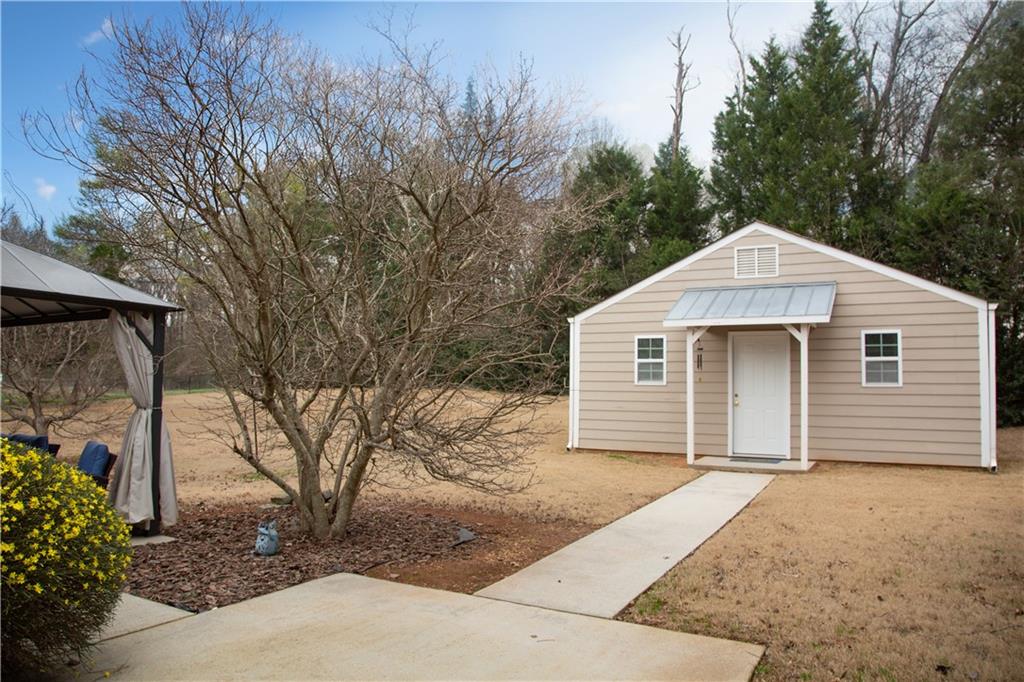 24 Austin Way Jefferson, GA 30549 - Photo 3 of 31 a front view of a house with a yard and garage