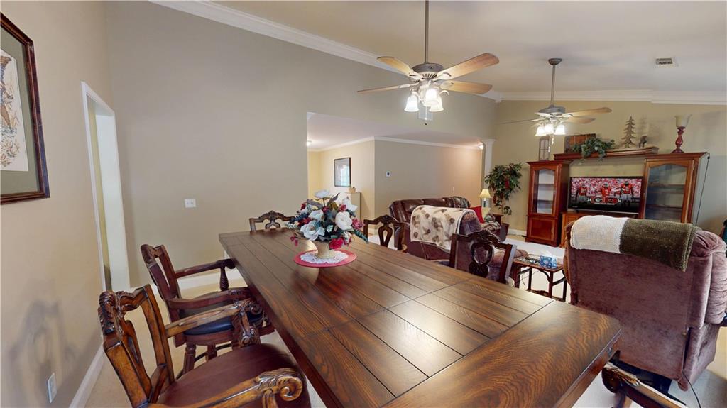 24 Austin Way Jefferson, GA 30549 - Photo 8 of 31 a view of a dining room with furniture and chandelier