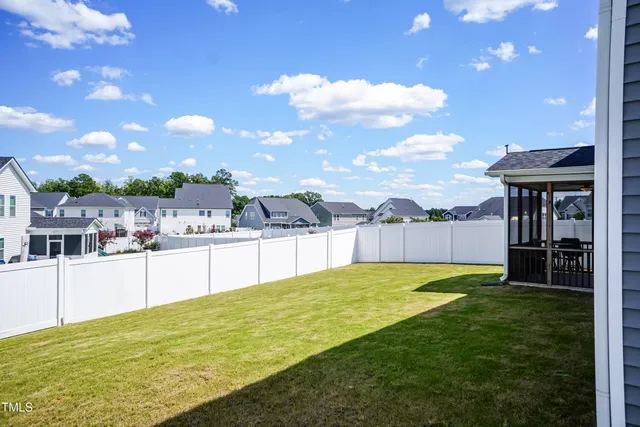 a view of a swimming pool with an outdoor seating and a garden view