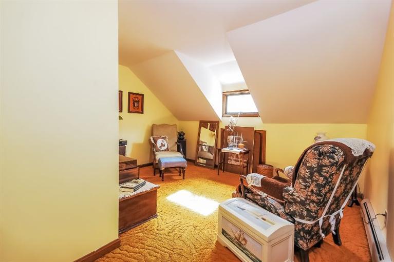 129 Cedar Hill Road East Dennis, MA 02660 - Photo 12 of 24 a living room with furniture and a rug