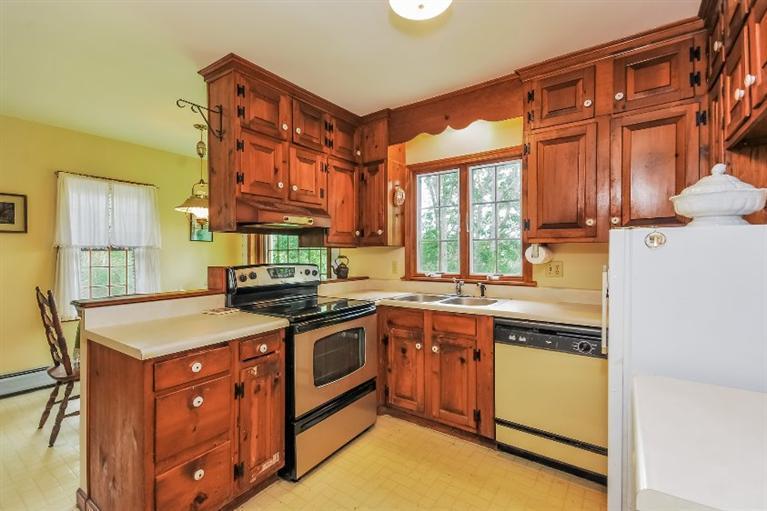 129 Cedar Hill Road East Dennis, MA 02660 - Photo 8 of 24 a kitchen with stainless steel appliances granite countertop a stove and a sink