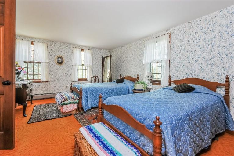 129 Cedar Hill Road East Dennis, MA 02660 - Photo 10 of 24 a bedroom with bed and window