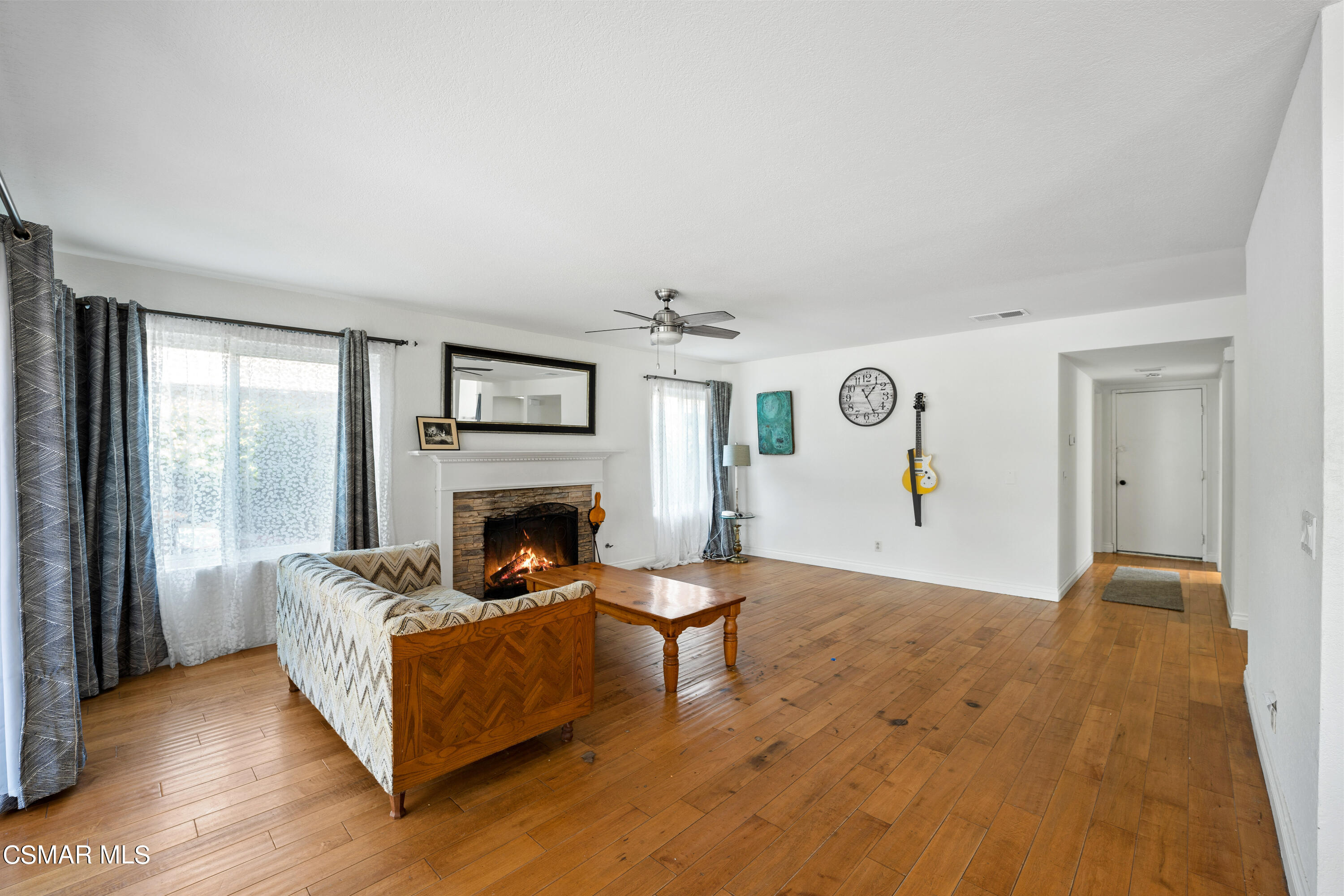 2835 Corte Caballos Camarillo, CA 93010 - Photo 11 of 35 a living room with furniture and a fireplace
