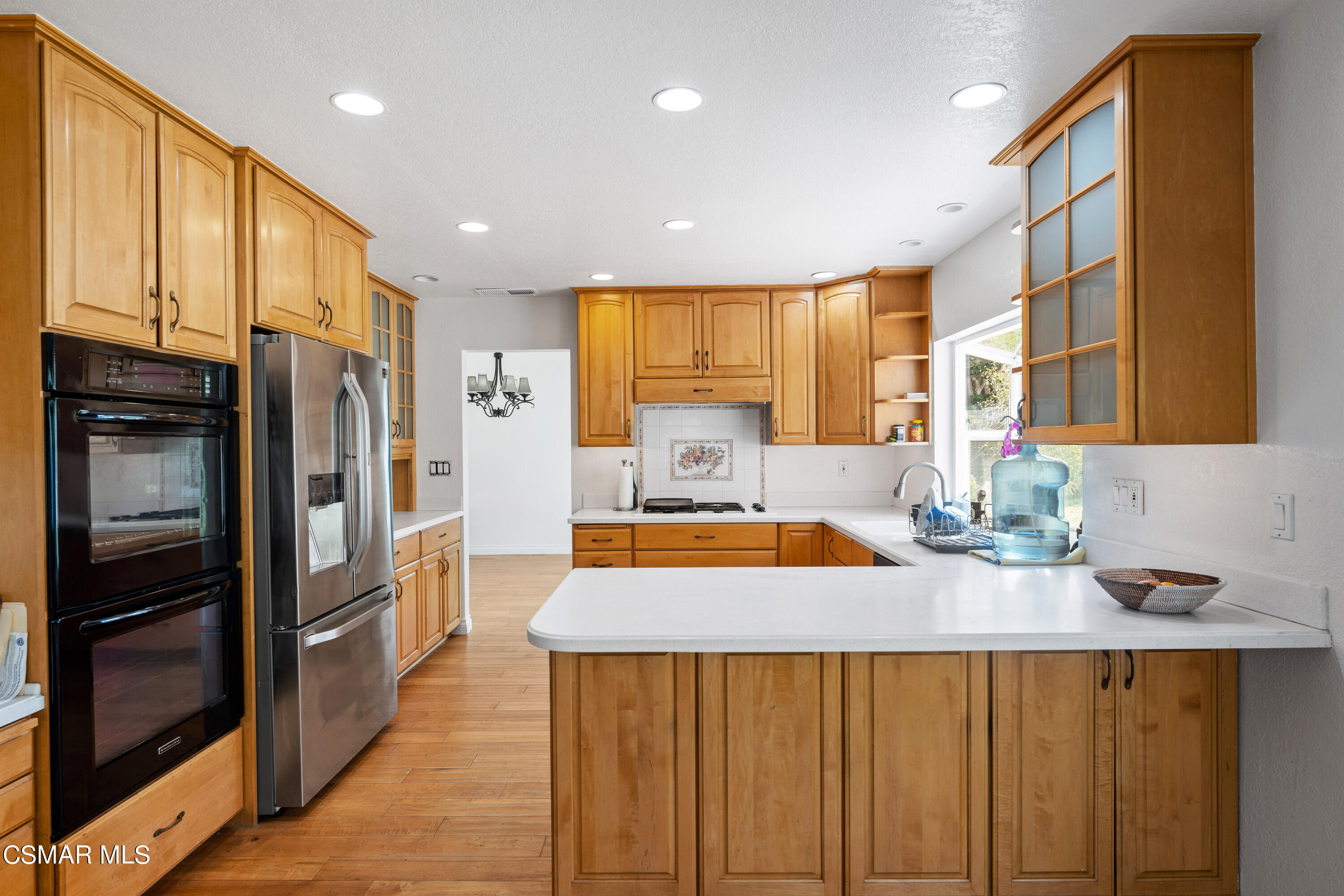 2835 Corte Caballos Camarillo, CA 93010 - Photo 13 of 35 a kitchen with stainless steel appliances granite countertop a sink refrigerator and cabinets