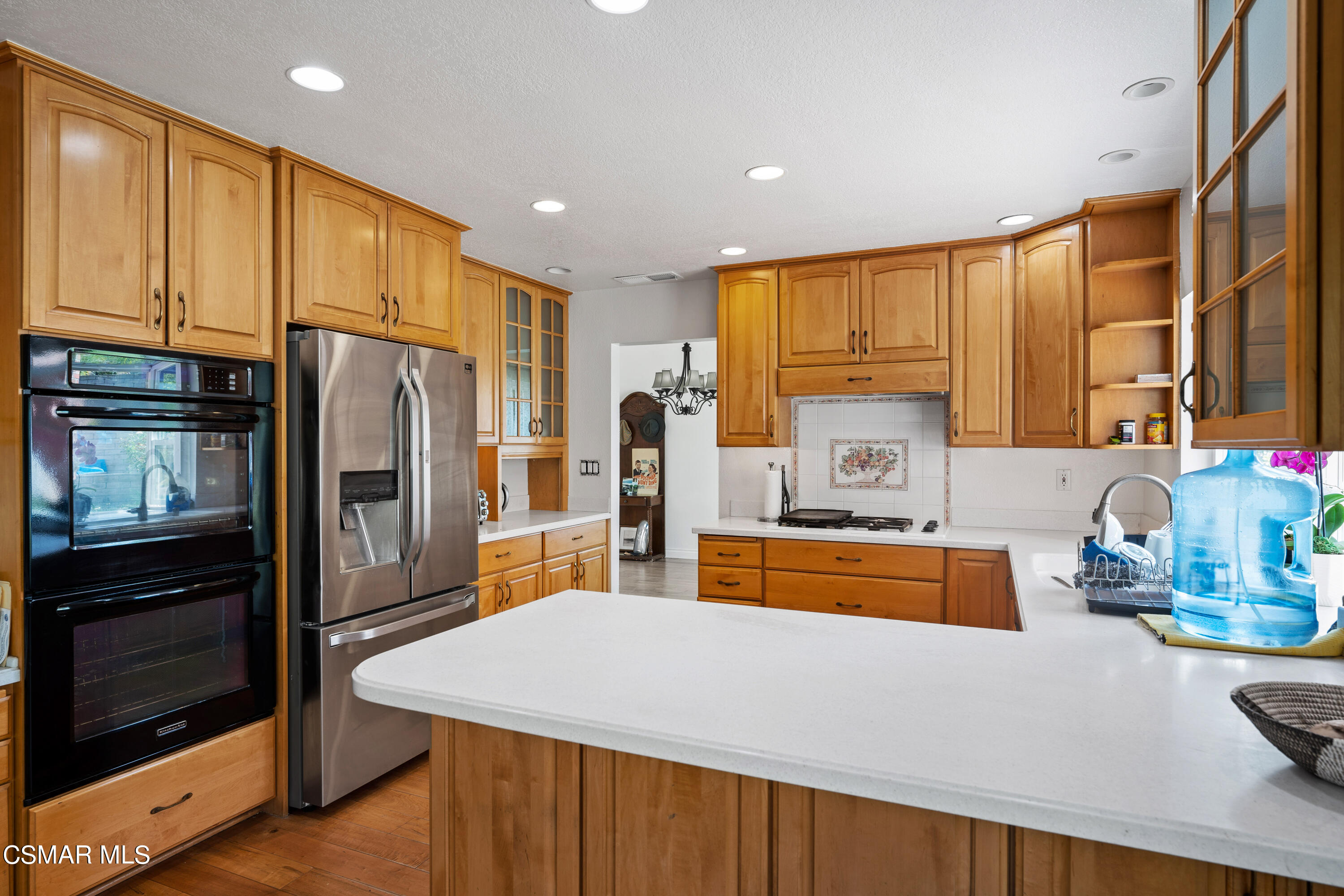 2835 Corte Caballos Camarillo, CA 93010 - Photo 14 of 35 a large kitchen with stainless steel appliances a large window in front of it