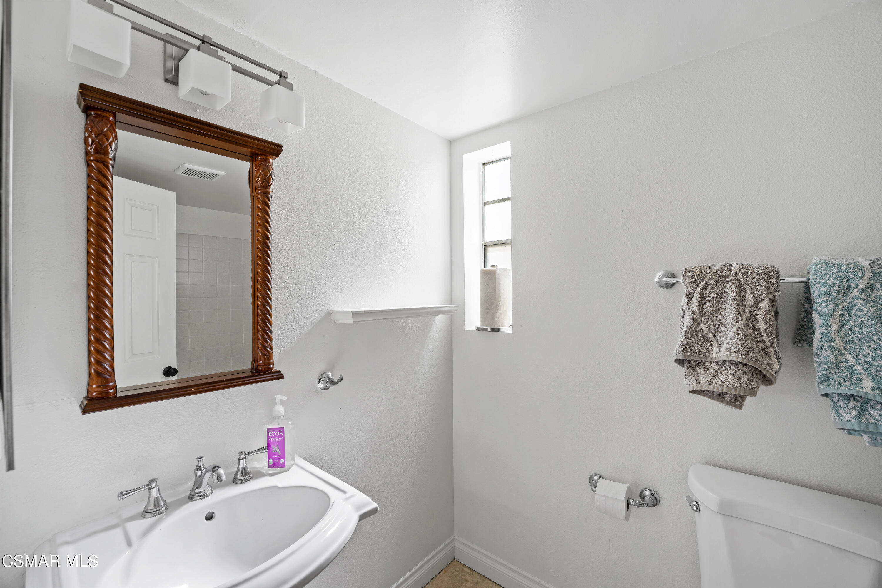 2835 Corte Caballos Camarillo, CA 93010 - Photo 17 of 35 a bathroom with a bathtub sink and mirror
