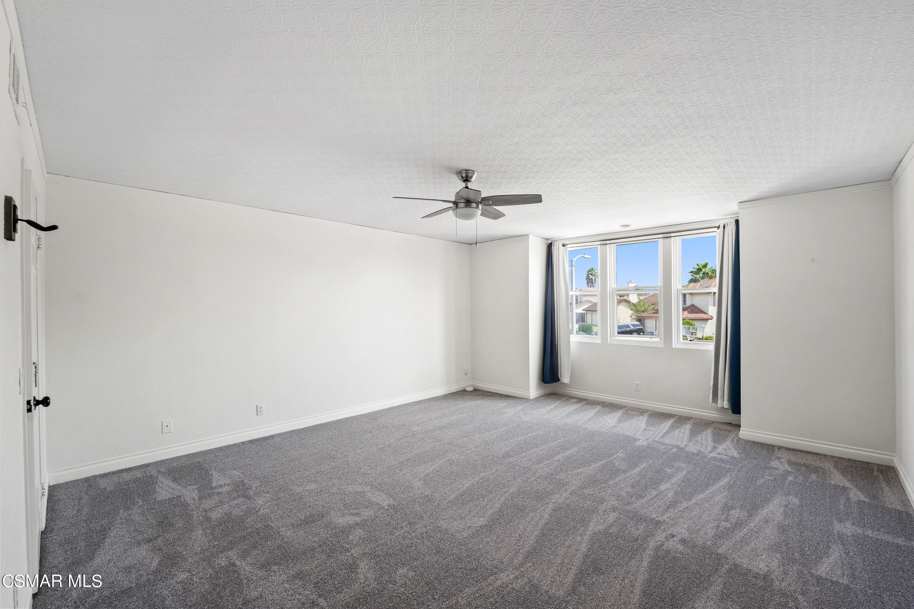 2835 Corte Caballos Camarillo, CA 93010 - Photo 18 of 35 a view of a livingroom with wooden floor and a ceiling fan