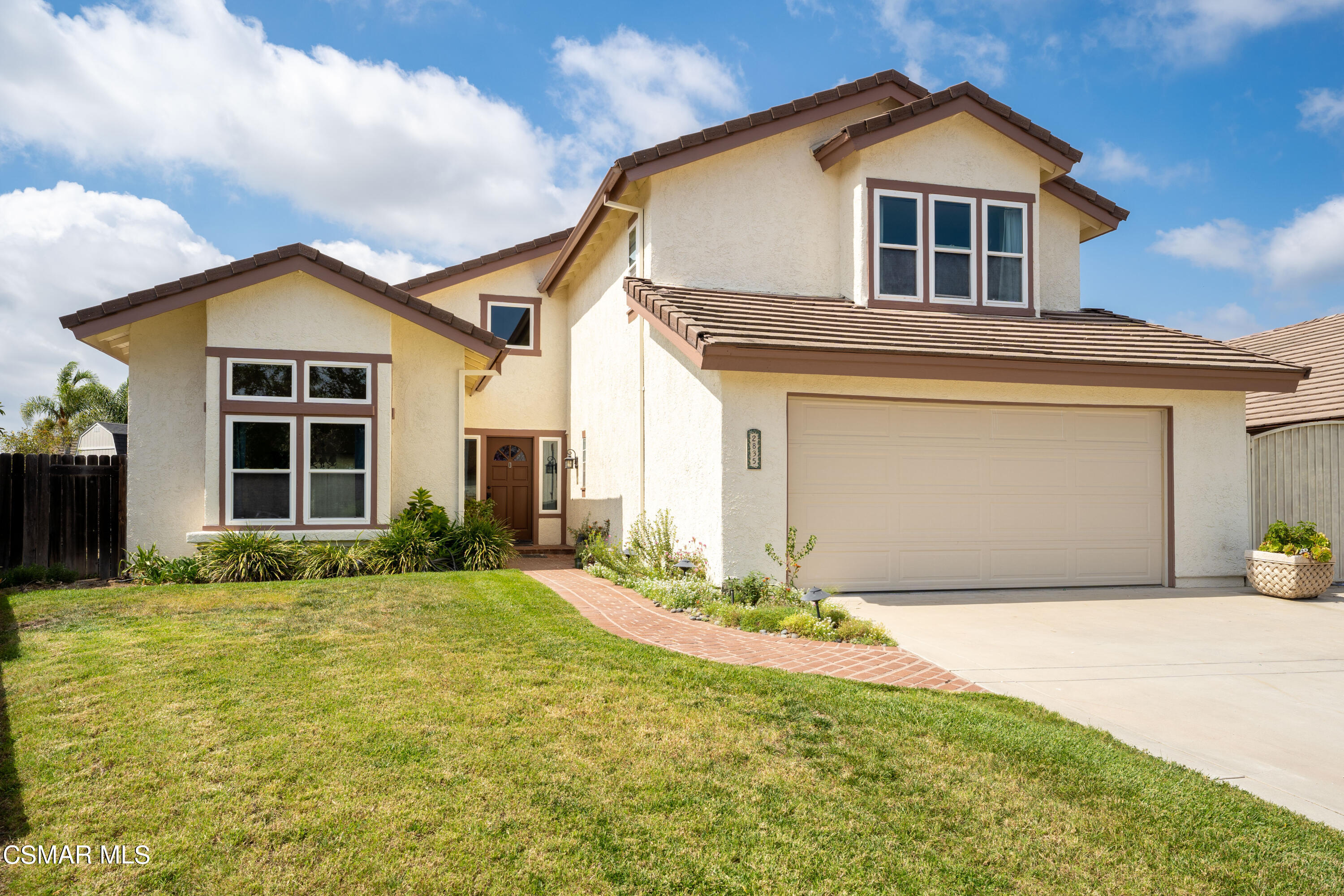 2835 Corte Caballos Camarillo, CA 93010 - Photo 2 of 35 a front view of a house with a yard