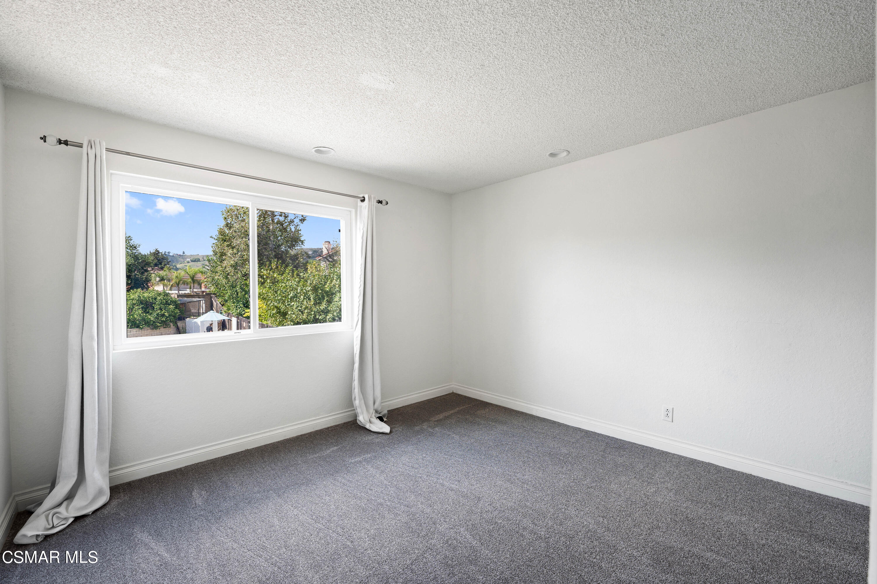 2835 Corte Caballos Camarillo, CA 93010 - Photo 24 of 35 a view of an empty room with a window
