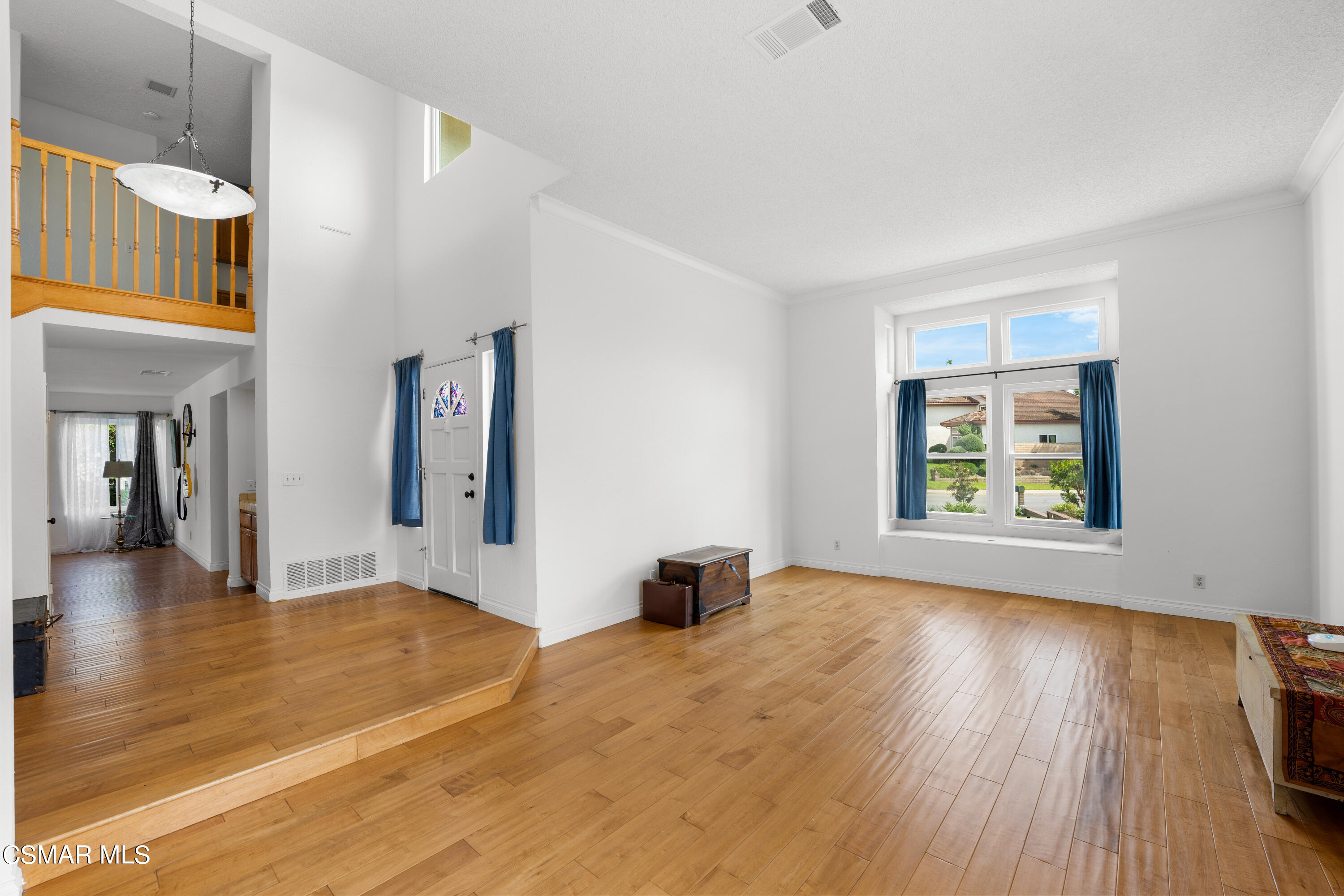 2835 Corte Caballos Camarillo, CA 93010 - Photo 5 of 35 a view of an empty room with wooden floor and a window