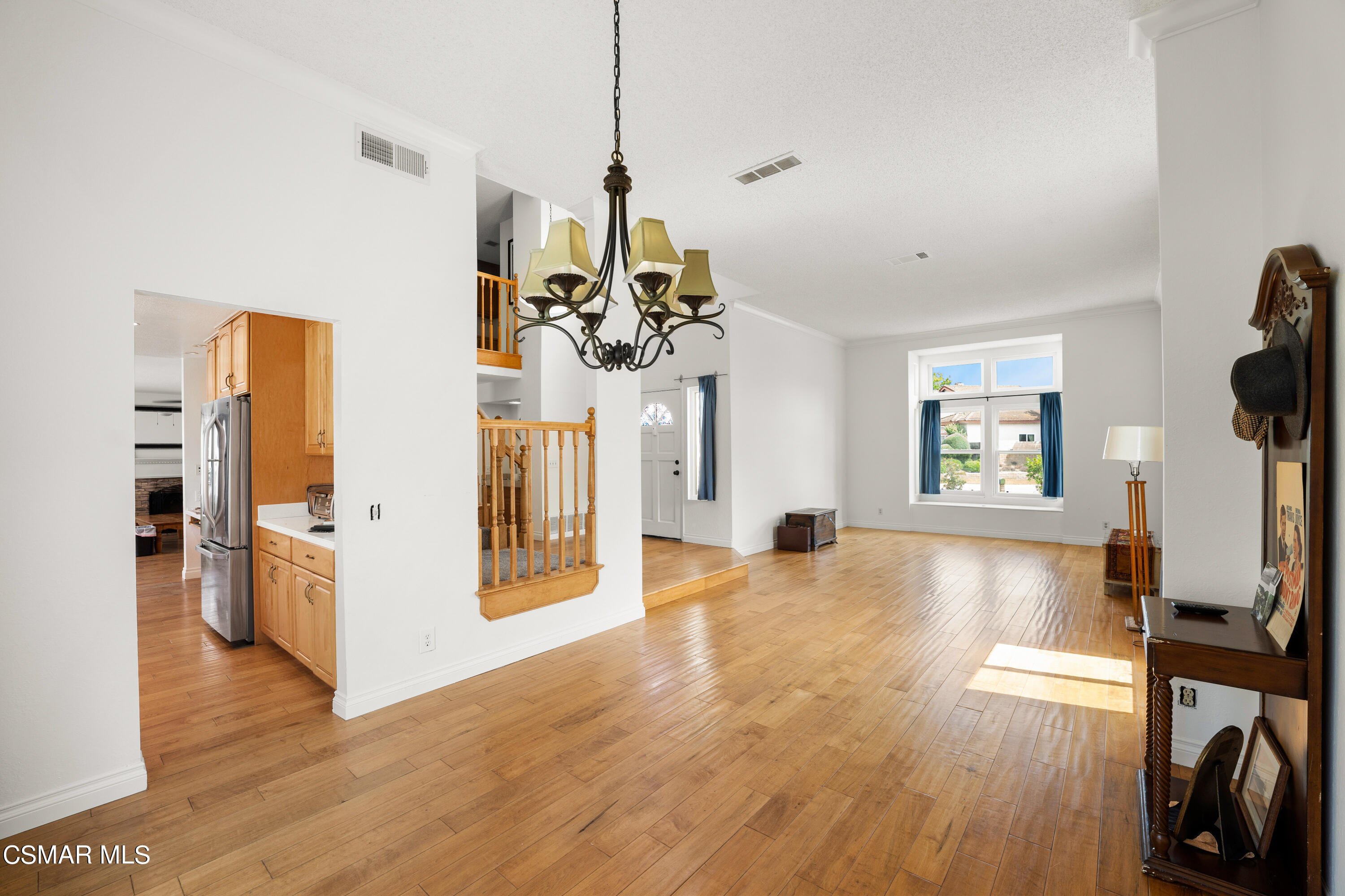2835 Corte Caballos Camarillo, CA 93010 - Photo 8 of 35 a view of a living room and a kitchen with a window