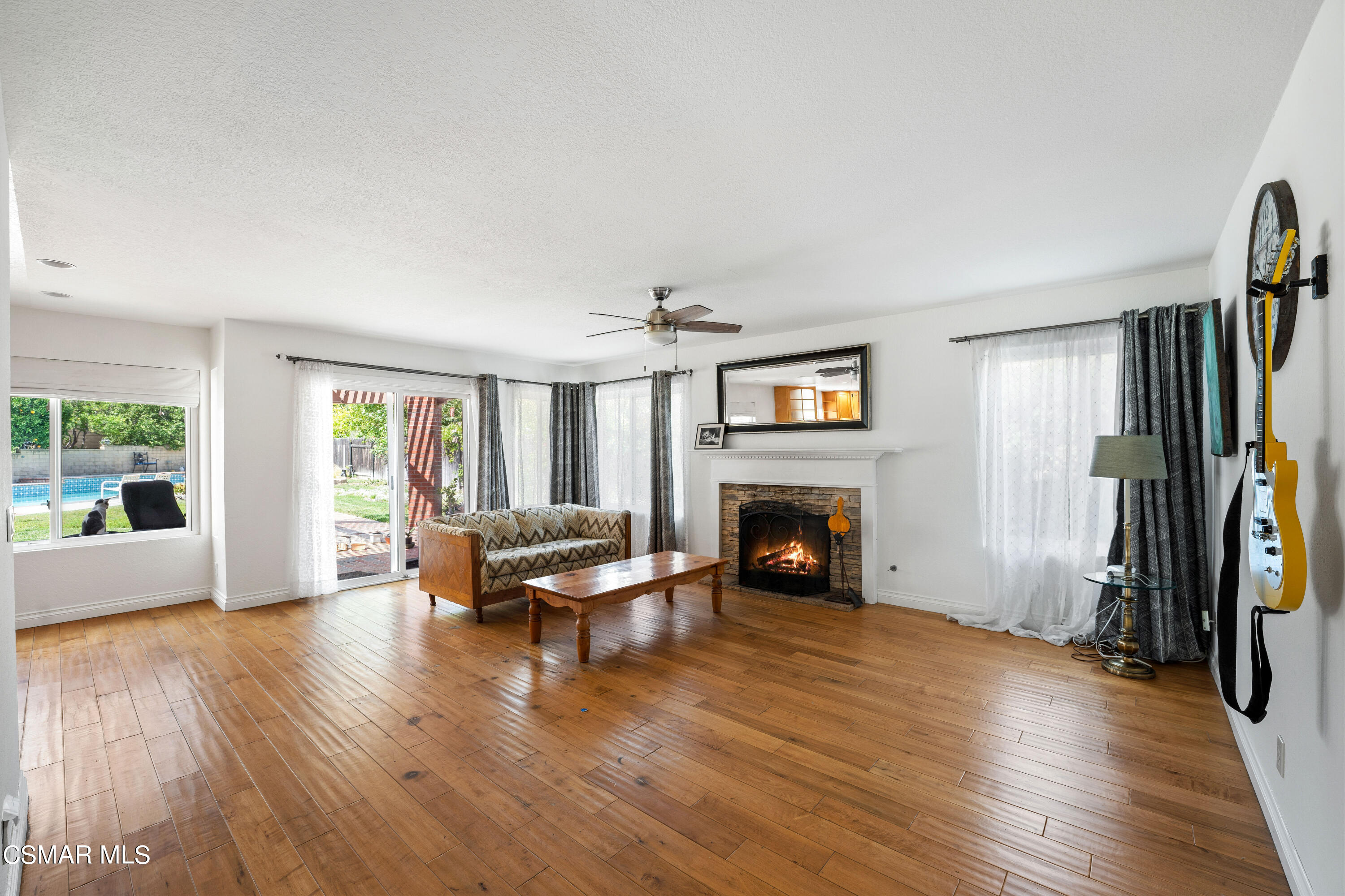 2835 Corte Caballos Camarillo, CA 93010 - Photo 9 of 35 a living room with furniture and a fireplace