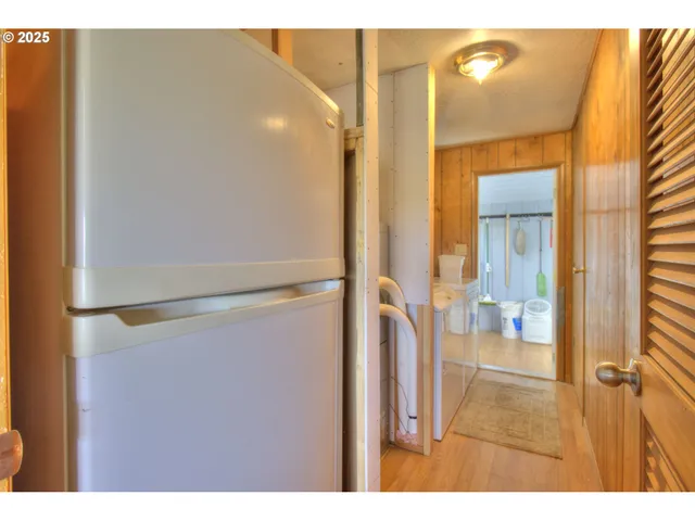 a bedroom with a bed dresser and a window