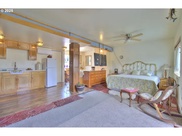 a living room with furniture and kitchen view