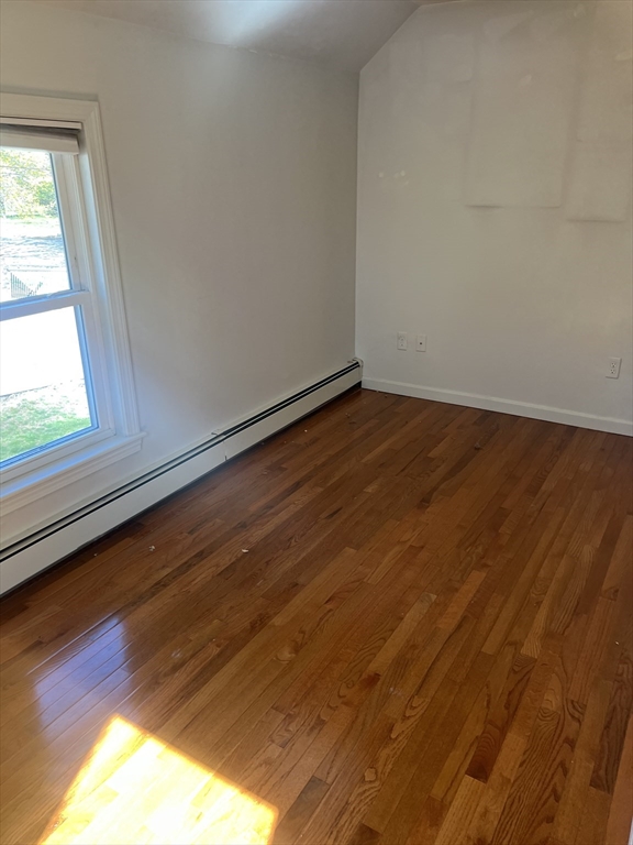 133 Pond Street Sharon, MA 02067 - Photo 14 of 17 a view of empty room with wooden floor and fan